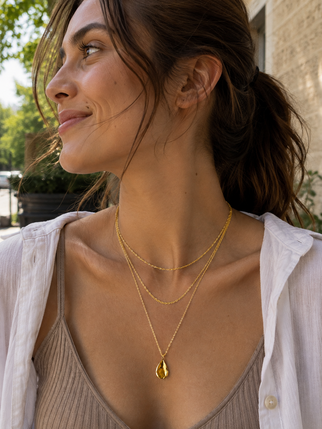 The Daily Pack layered necklaces on a model